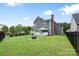 View of the backyard showing a gazebo, fire pit, and privacy fencing at 1358 Colwick Ln, Rock Hill, SC 29732