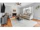 Inviting living room with fireplace, large windows, and comfortable seating arrangements at 1358 Colwick Ln, Rock Hill, SC 29732