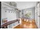 Mudroom area with seating and storage, leading into a brightly lit dining space at 1358 Colwick Ln, Rock Hill, SC 29732