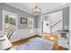 Bright home office with hardwood floors, wainscoting, crown molding, and ample natural light from multiple windows at 1358 Colwick Ln, Rock Hill, SC 29732