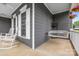 Inviting front porch with white rocking chairs and a cozy porch swing, perfect for enjoying the outdoors at 1358 Colwick Ln, Rock Hill, SC 29732