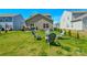 Spacious backyard features a well-maintained lawn, patio seating, ideal for outdoor gatherings and relaxation at 15813 Capps Rd, Charlotte, NC 28278