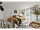 Bright bedroom features a large bed with decorative pillows, a stylish rug, and natural light from the window at 15813 Capps Rd, Charlotte, NC 28278