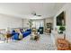 Cozy living room featuring comfortable seating, a patterned rug, and a ceiling fan, perfect for relaxation at 15813 Capps Rd, Charlotte, NC 28278