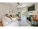 Inviting living room with a cozy fireplace, neutral decor, and sliding glass doors to the backyard at 15813 Capps Rd, Charlotte, NC 28278