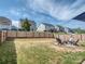 Spacious fenced backyard, ideal for relaxation and entertaining, featuring a fire pit at 1607 Tundra Ln, Denver, NC 28037