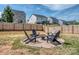 Large fenced yard with fire pit sitting area, perfect for outdoor activities and gatherings at 1607 Tundra Ln, Denver, NC 28037