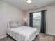 Bedroom with plush carpeting, window and black out curtains at 1607 Tundra Ln, Denver, NC 28037