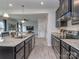 Beautiful kitchen featuring granite counters, stainless appliances, and open-concept living at 1607 Tundra Ln, Denver, NC 28037