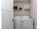 Efficient laundry area with modern washer and dryer units and overhead storage shelf at 1607 Tundra Ln, Denver, NC 28037