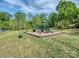 Community playground featuring slides, climbing structures and a picnic table for outdoor fun at 1607 Tundra Ln, Denver, NC 28037