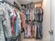 Organized walk-in closet with ample hanging space, shelving, and storage for clothes and accessories at 1607 Tundra Ln, Denver, NC 28037