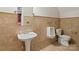 Tiled bathroom with a pedestal sink, toilet, and a urinal at 172 Fairway Cir, Rock Hill, SC 29730