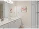 Bright bathroom with a large mirror, white vanity, and neutral wall paint at 172 Fairway Cir, Rock Hill, SC 29730