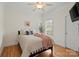 Cozy bedroom with hardwood floors, a ceiling fan, and a window with blinds at 172 Fairway Cir, Rock Hill, SC 29730
