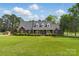 Stunning brick home featuring dormer windows, manicured lawn, and mature trees at 172 Fairway Cir, Rock Hill, SC 29730
