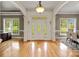 Spacious foyer with hardwood floors, decorative front door, and views into the dining room at 172 Fairway Cir, Rock Hill, SC 29730