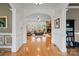 Elegant foyer with hardwood floors and archway leading to a cozy living room with fireplace at 172 Fairway Cir, Rock Hill, SC 29730