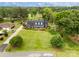 Beautifully landscaped front yard with mature trees and a charming brick home at 172 Fairway Cir, Rock Hill, SC 29730