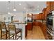 Bright kitchen featuring a breakfast bar, wooden cabinets, and hardwood floors at 172 Fairway Cir, Rock Hill, SC 29730