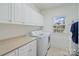 Bright laundry room featuring lots of storage space and modern washer and dryer at 172 Fairway Cir, Rock Hill, SC 29730