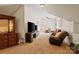 Carpeted living room with comfortable seating and a large TV at 172 Fairway Cir, Rock Hill, SC 29730