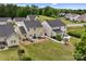 Aerial view of the backyard with well-maintained lawn, patio, and inviting outdoor space at 176 Jennymarie Rd, Mooresville, NC 28115