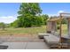 Inviting backyard oasis featuring a covered lounge area, lush lawn, and mature trees, perfect for relaxation and outdoor gatherings at 176 Jennymarie Rd, Mooresville, NC 28115