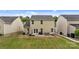Spacious backyard with a well-maintained lawn and patio seating area, offering a perfect setting for outdoor activities and relaxation at 176 Jennymarie Rd, Mooresville, NC 28115