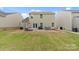 Expansive backyard featuring a patio with seating, a lounge area, and a well-kept lawn, ideal for outdoor entertainment and leisure at 176 Jennymarie Rd, Mooresville, NC 28115