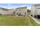 Large backyard with patio seating, a lounge area, and ample green space, perfect for outdoor enjoyment and activities at 176 Jennymarie Rd, Mooresville, NC 28115
