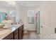 Well-lit bathroom with a double vanity, granite countertops, and separate shower, offering functionality and style at 176 Jennymarie Rd, Mooresville, NC 28115