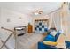 Cozy upstairs bedroom with a blue sofa, storage shelves, and comfortable decor at 176 Jennymarie Rd, Mooresville, NC 28115