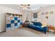Charming bedroom featuring a blue sofa, carpeted floors, and natural light at 176 Jennymarie Rd, Mooresville, NC 28115