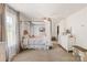 Inviting bedroom features a draped canopy bed, soft carpet, and natural light from the window at 176 Jennymarie Rd, Mooresville, NC 28115