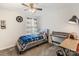 Bedroom featuring ceiling fan, striped curtains and decorative elements on the walls at 176 Jennymarie Rd, Mooresville, NC 28115