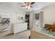 Upstairs bedroom with natural light, a dresser, and a view of the neighborhood at 176 Jennymarie Rd, Mooresville, NC 28115
