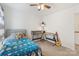 Bedroom featuring ceiling fan, space themed accents, and ample natural light at 176 Jennymarie Rd, Mooresville, NC 28115