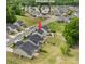 Aerial view of the neighborhood with a community pool highlighted in the distance at 176 Jennymarie Rd, Mooresville, NC 28115