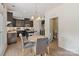 Bright dining area adjacent to the kitchen, featuring a round table and stylish chairs at 176 Jennymarie Rd, Mooresville, NC 28115