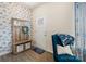 Welcoming foyer featuring stylish decor, a wooden hall tree, and a patterned accent wall at 176 Jennymarie Rd, Mooresville, NC 28115