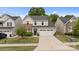 Inviting two-story home with a two-car garage, manicured lawn, and a welcoming front entrance at 176 Jennymarie Rd, Mooresville, NC 28115