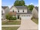 Charming two-story home featuring a well-manicured lawn, a two-car garage, and a welcoming front door at 176 Jennymarie Rd, Mooresville, NC 28115