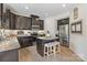 Kitchen with dark cabinets, stainless steel appliances, and island seating at 176 Jennymarie Rd, Mooresville, NC 28115