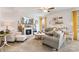 Cozy living room featuring a fireplace, TV, and ample seating at 176 Jennymarie Rd, Mooresville, NC 28115