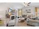 Cozy living room with a fireplace, comfortable seating, and a mounted television at 176 Jennymarie Rd, Mooresville, NC 28115