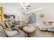 Open-concept living room with neutral tones, fireplace, and stairway at 176 Jennymarie Rd, Mooresville, NC 28115