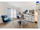 Comfortable office with a large desk, bookshelf, stylish blue decor and natural light at 176 Jennymarie Rd, Mooresville, NC 28115