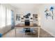 Well-lit office featuring a spacious desk, custom shelving, and elegant blue accents at 176 Jennymarie Rd, Mooresville, NC 28115