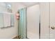 Bright, clean shower with white tile and a glass door, complemented by soft-colored accents at 176 Jennymarie Rd, Mooresville, NC 28115